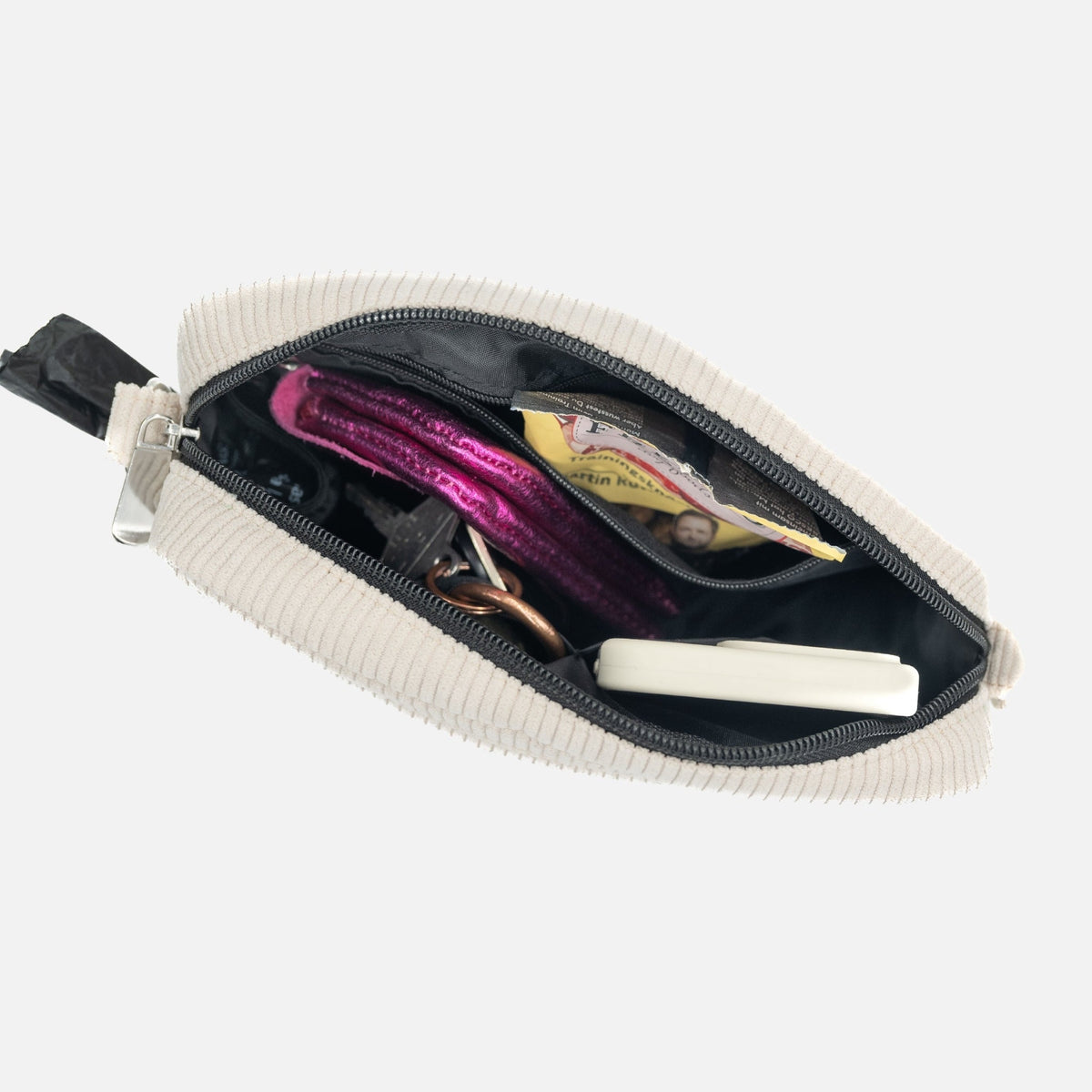 Gassitasche aus Cord in Creme, von oben geöffnet, Blick auf die Innenfächer